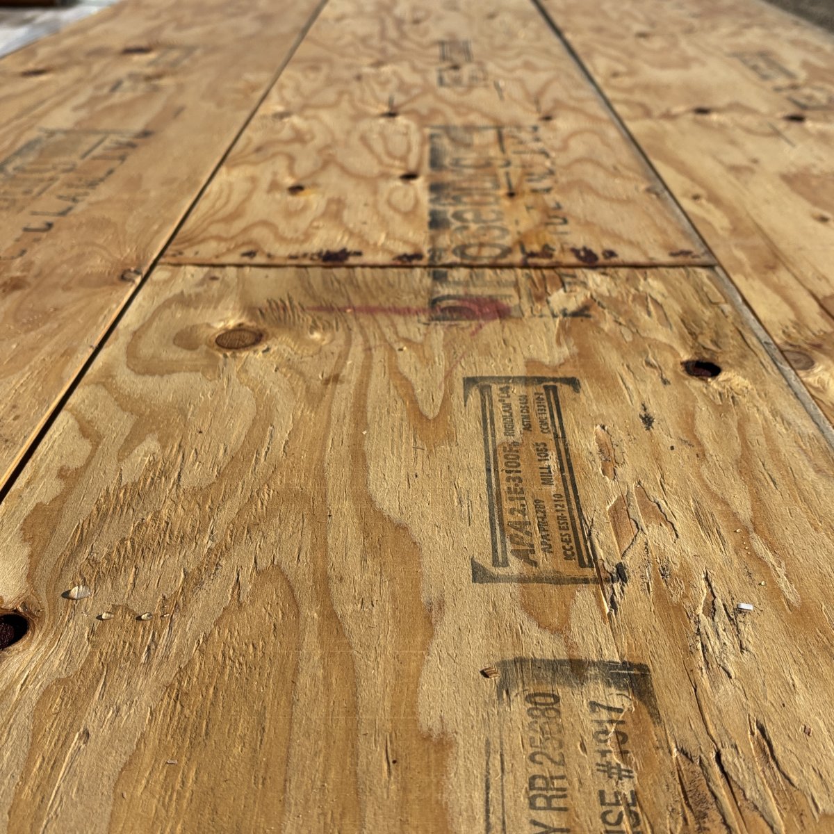 Close-up angled view of wood grain texture on 1-3/4 inch by 16 inch LVL showing layered veneer structure