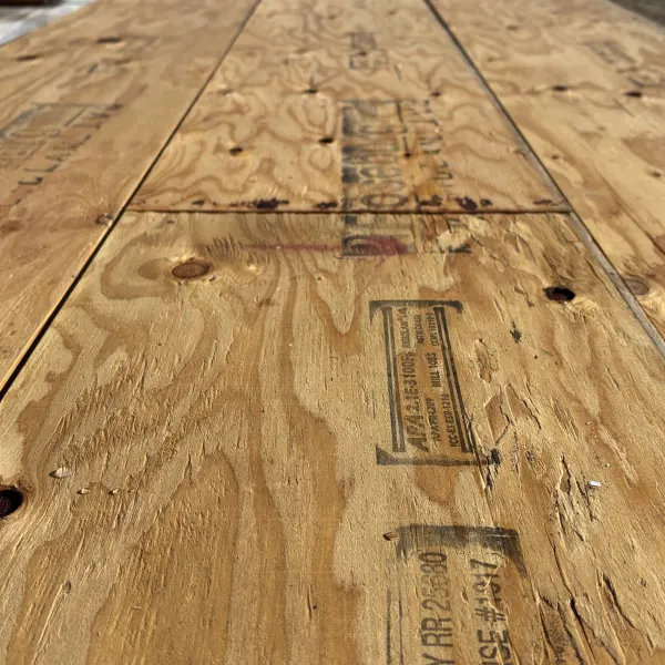 Close-up angled view of wood grain texture on 1-3/4 inch by 16 inch LVL showing layered veneer structure