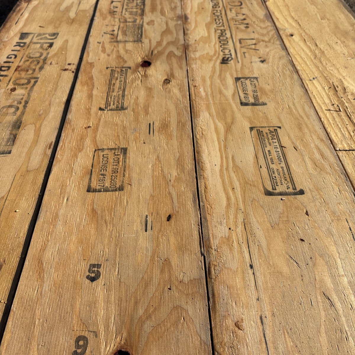 Close-up angled view of wood grain texture on 1-3/4 inch by 9-1/2 inch LVL showing layered veneer structure