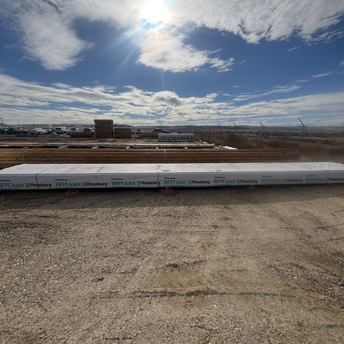 Single RFPI-400 14 inch engineered wood I-joist unit shown at Boise lumberyard against blue sky background