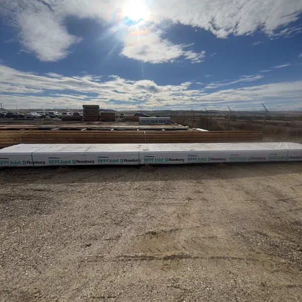 Single RFPI-400 14 inch engineered wood I-joist unit shown at Boise lumberyard against blue sky background