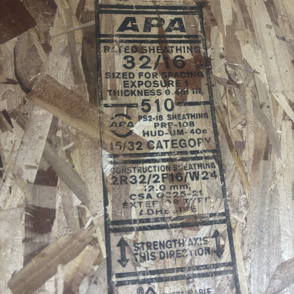 Mill grade stamp on 15/32 inch OSB sheathing showing Exposure 1 rating and 32/16 span rating