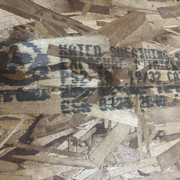 Mill grade stamp on 19/32 inch OSB panel showing structural grade and certification markings