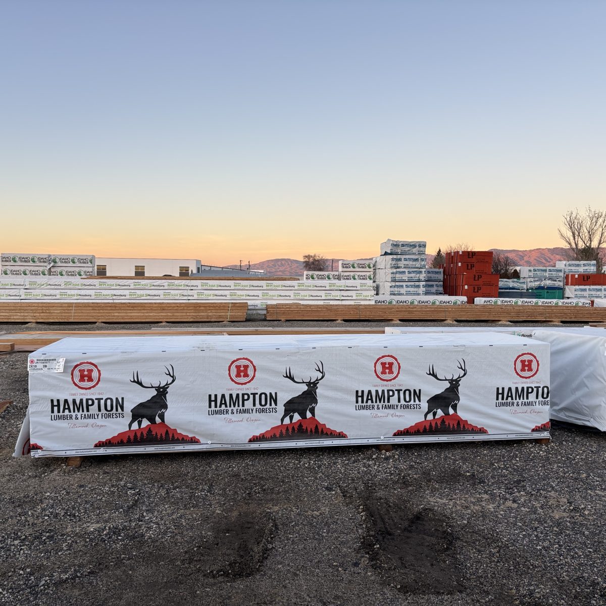 Wide yard view of 2x10x14 foot number 2 grade kiln-dried Hem-Fir lumber stocked at Boise lumberyard
