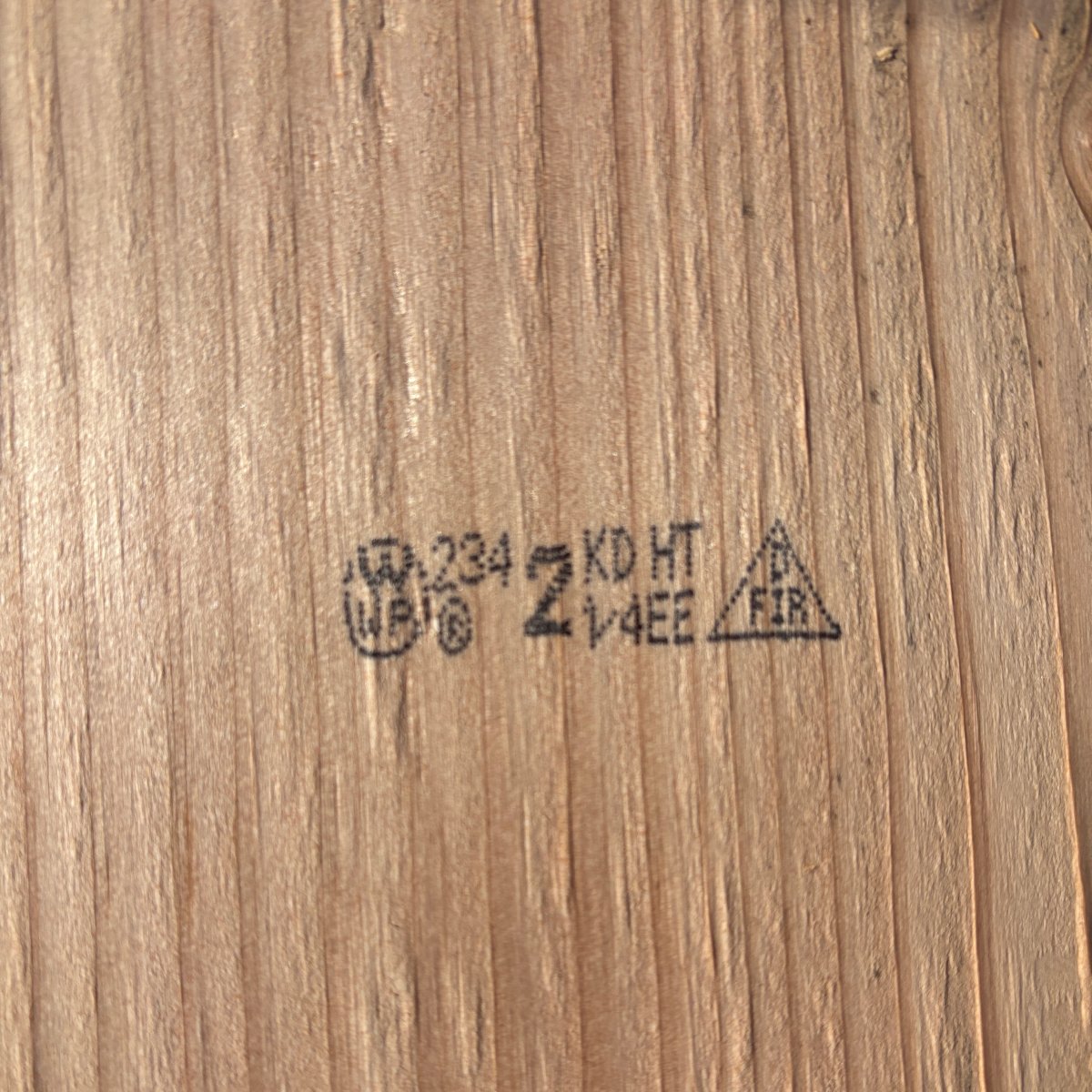 Grade stamp on 2×10 #2 kiln-dried Douglas Fir lumber showing grade and mill identification