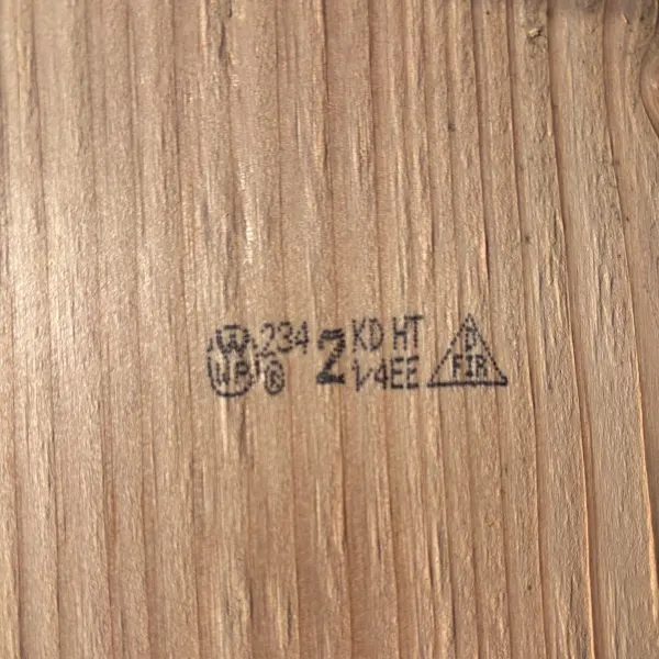 Grade stamp on 2×10 #2 kiln-dried Douglas Fir lumber showing grade and mill identification