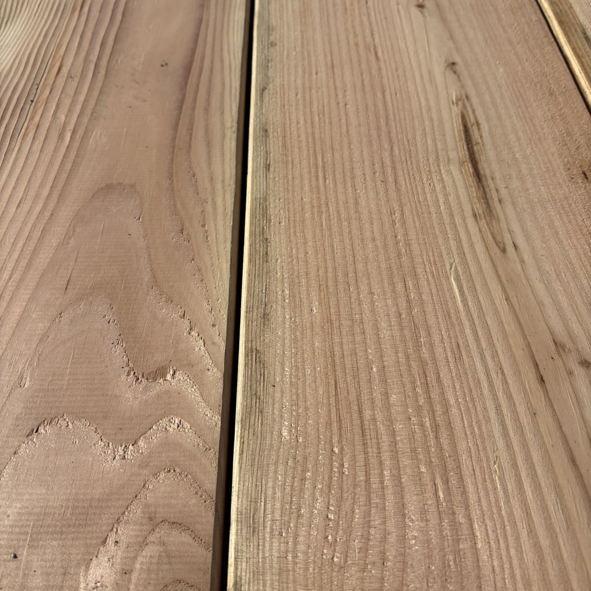 Close-up angled view of Douglas Fir wood grain on 2×10 #2 kiln-dried lumber showing natural texture and grain pattern