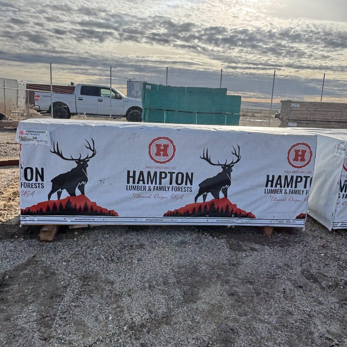 2×12×8′ #2 kiln-dried Hem-Fir lumber stacked at Boise lumberyard with delivery truck behind