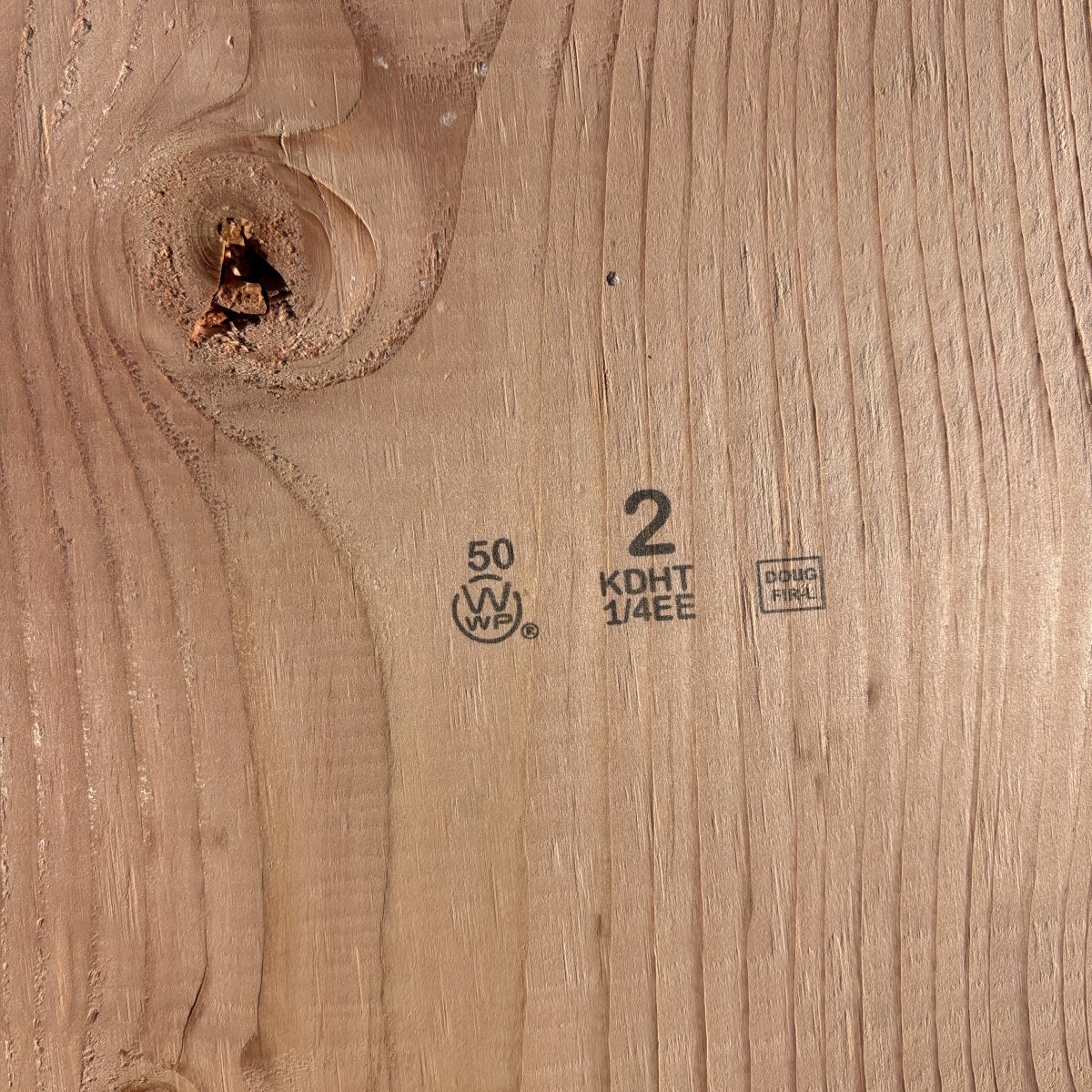 Grade stamp on 2×12 #2 kiln-dried Douglas Fir lumber showing grade and mill identification