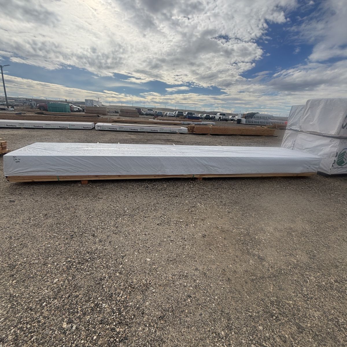Wrapped full unit of 2×4×20′ #2 kiln-dried Douglas Fir lumber staged at our Boise lumberyard