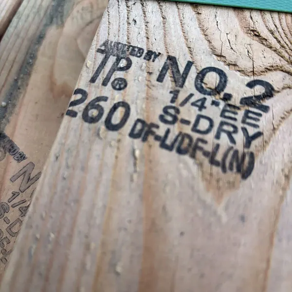Grade stamp and lumber marking on 2×4 #2 kiln-dried Douglas Fir precut studs at our Boise lumberyard