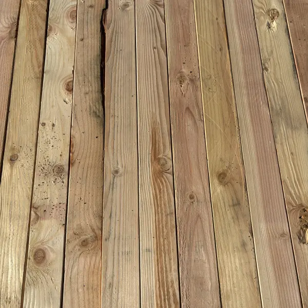 Top-down view of Douglas Fir wood texture on 2×4 #2 kiln-dried lumber showing grain pattern and surface detail