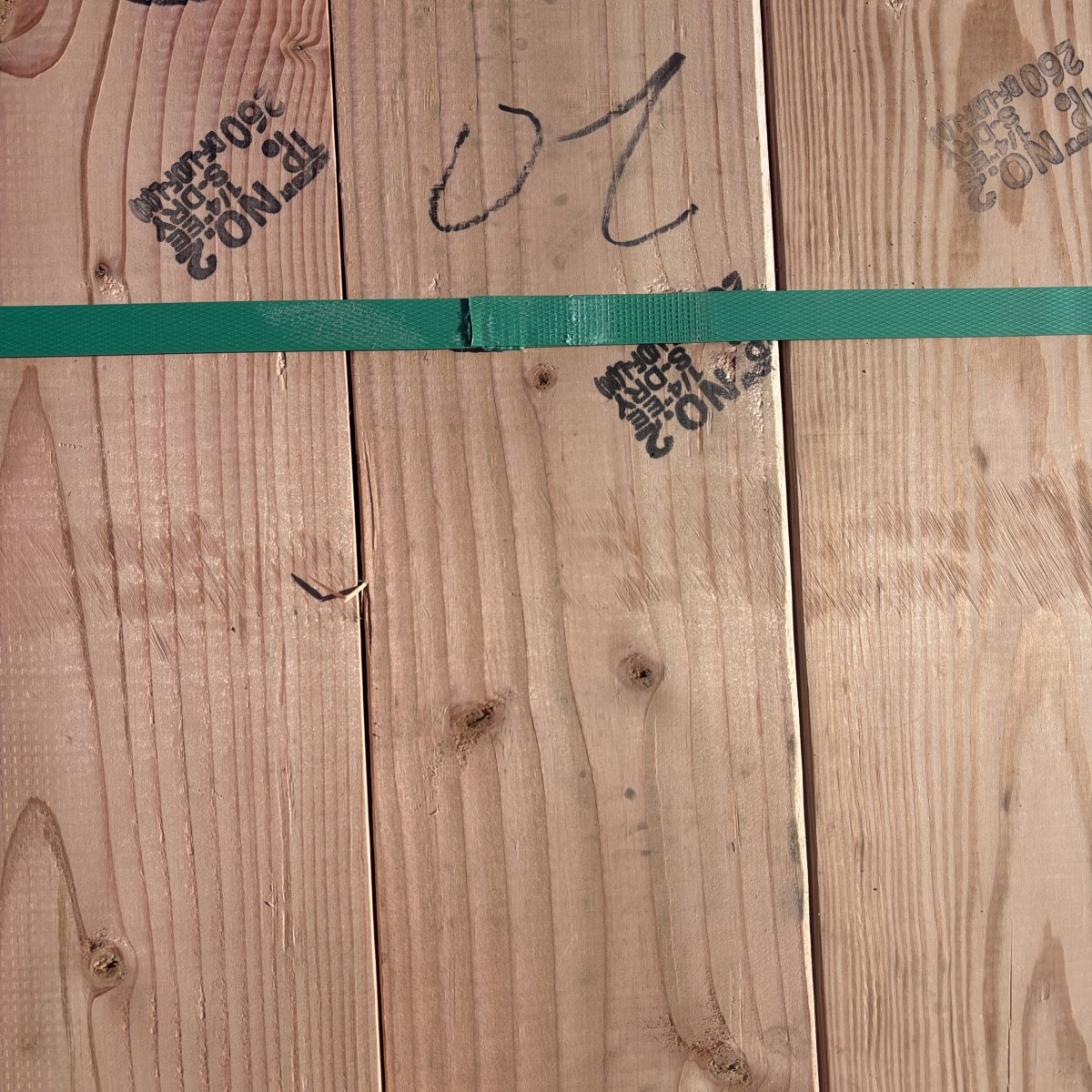 Grade stamp on 2×6 #2 kiln-dried Douglas Fir lumber showing grade and mill identification