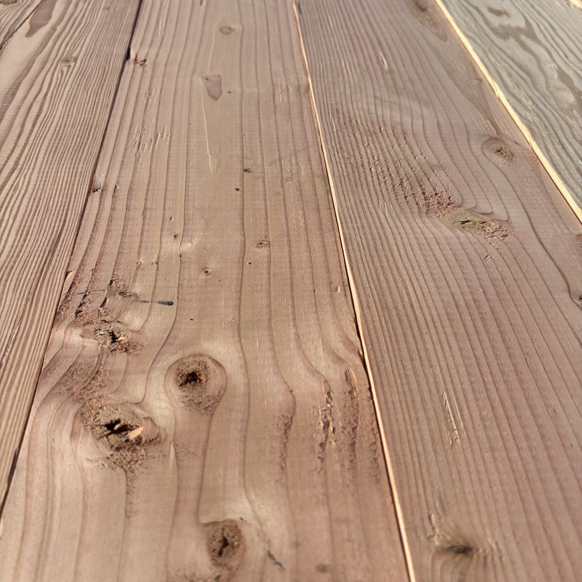 Close-up angled view of Douglas Fir wood grain on 2×6 #2 kiln-dried lumber showing natural texture and grain pattern