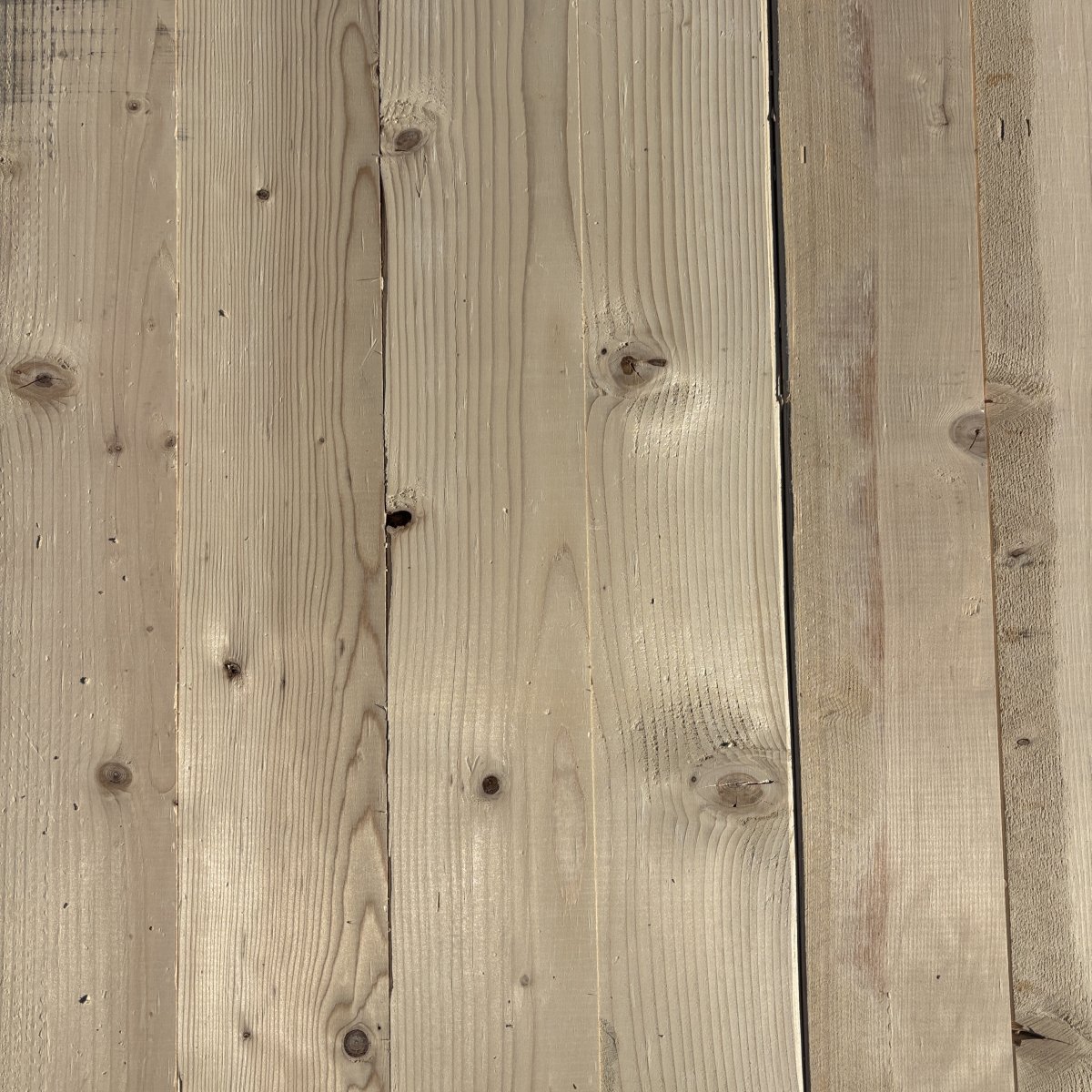 Top-down view of Hem-Fir wood texture on 2×6 #2 kiln-dried lumber showing grain pattern and surface detail