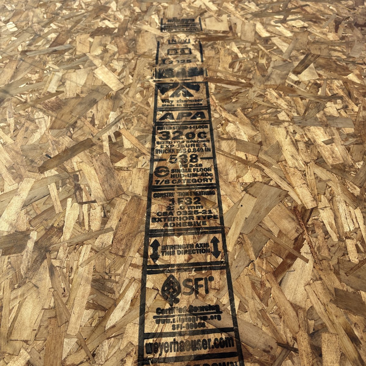 7/8 inch tongue and groove OSB subfloor sheathing 4x8 stacked at Boise lumberyard side view